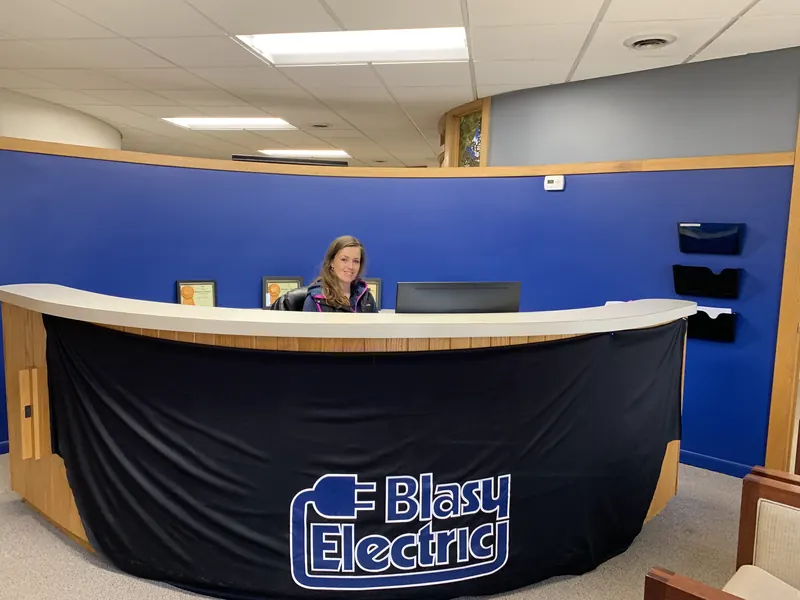 The Blasy Electric front desk, with the company logo on the counter